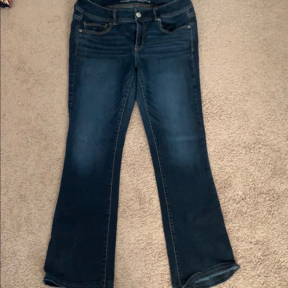 Dark wash boot cut jeans.